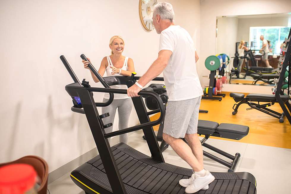 Couple exercising on the cross trainer